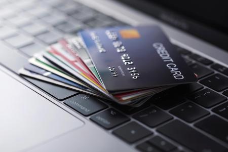 credit cards and laptop keyboard
